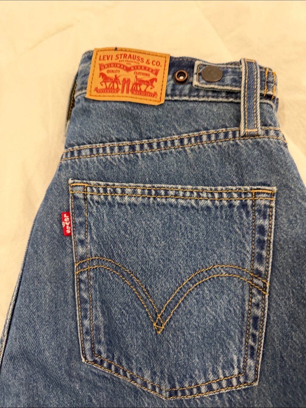 Levi's High-Rise Blue Denim Women's Jeans with Tan Leather Patch